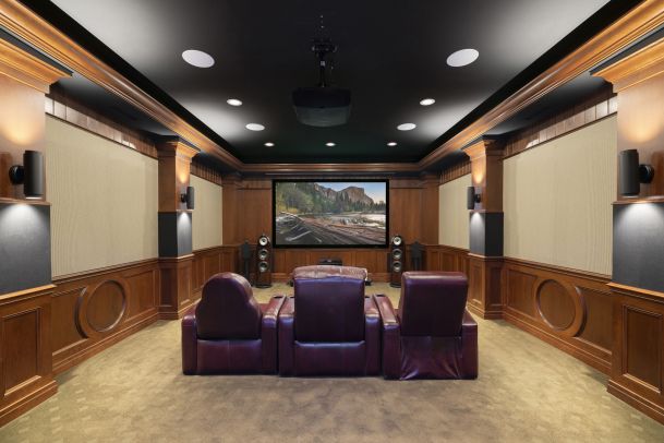 Luxury home theater with leather recliners and large screen