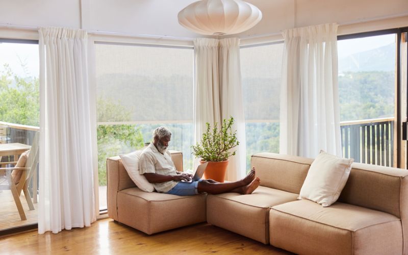 family room with white couch and TV